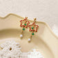 Boucles d’oreilles pendantes mignonnes en forme d’étoile de Noël