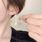 Boucles d'oreilles et collier pendentif croix étincelant