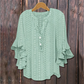 Blouse élégante à col en V et manches à volant
