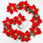 Guirlande lumineuse de Noël avec des poinsettias